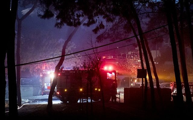 Israeli firefighters help extinguish a fire in the northern city of Haifa on November 24, 2016. (Jack Guez/AFP) Israeli firefighters help extinguish a fire in the northern city of Haifa on November 24, 2016. (Jack Guez/AFP)