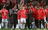 Hapoel Beesheba's players celebrate after winning the UEFA Europa League group K football match against Italy's Inter Milan at the Turner Stadium in the southern city of Beersheba, November 24, 2016. (AFP/Gil Cohen-Magen)