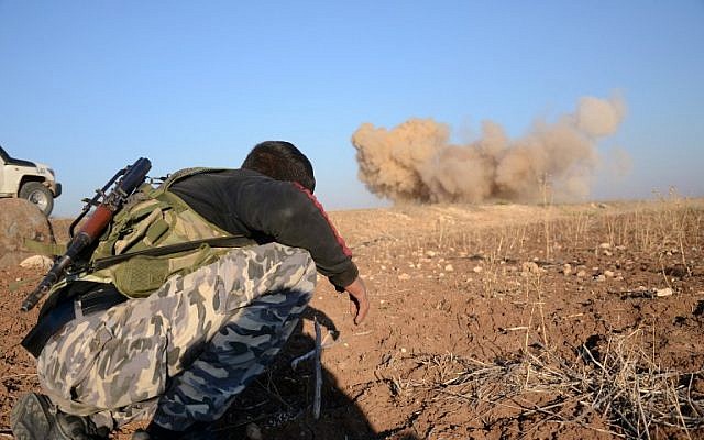 A rebel fighter reacts as a landmine, planted by Islamic State jihadists, is exploded by his comrades in the village of Tilalayn on the western outskirts of the northern Syrian town of Dabiq, on November 25, 2016. (AFP/ Nazeer al-Khatib) A rebel fighter reacts as a landmine, planted by Islamic State jihadists, is exploded by his comrades in the village of Tilalayn on the western outskirts of the northern Syrian town of Dabiq, on November 25, 2016. (AFP/ Nazeer al-Khatib)