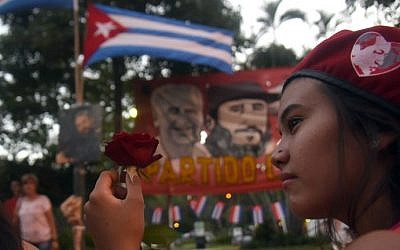Supporters of Paraguay's Communist Party gather in Asuncion to pay tribute to deceased Cuban leader Fidel Castro on November 26, 2016. (Norberto Duarte/AFP)