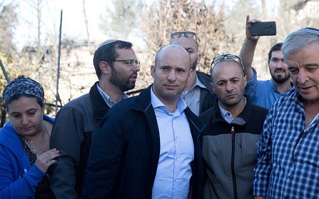 Naftali Bennett, center, in the Halamish settlement on November 27, 2016. (AFP/MENAHEM KAHANA)