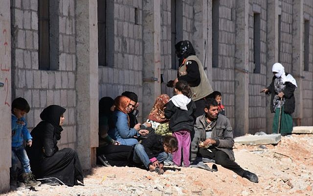 Syrian displaced families gather at a makeshit camp in the government-held district of Jibreen in Aleppo, November 27, 2016. (AFP/GEORGE OURFALIAN)