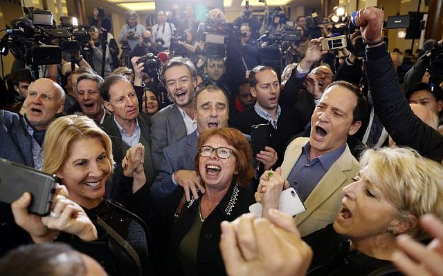 Supporters of French presidential candidate Francois Fillon at the campaign headquarters of their candidate on November 27, 2016, in Paris.(AFP PHOTO / Thomas SAMSON)