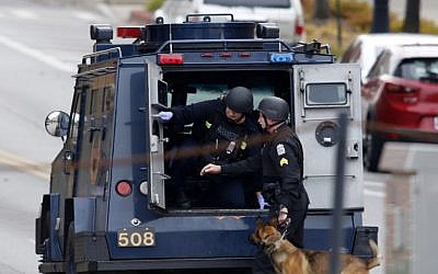 Law enforcement officials are seen outside of a parking garage on the campus of Ohio State University as they respond to an active attack in Columbus, Ohio, on November 28, 2016. (AFP PHOTO / Paul Vernon) Law enforcement officials are seen outside of a parking garage on the campus of Ohio State University as they respond to an active attack in Columbus, Ohio, on November 28, 2016. (AFP PHOTO / Paul Vernon)