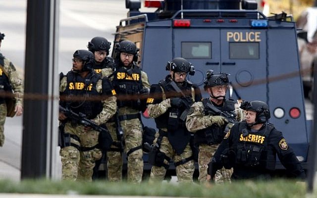 Law enforcement officials are seen outside of a parking garage on the campus of The Ohio State University as they respond to an active attack in Columbus, Ohio, on November 28, 2016. (AFP/ Paul Vernon) Law enforcement officials are seen outside of a parking garage on the campus of The Ohio State University as they respond to an active attack in Columbus, Ohio, on November 28, 2016. (AFP/ Paul Vernon)