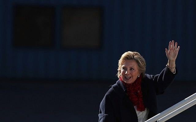 Democratic presidential nominee and former secretary of state Hillary Clinton waves as she boards her campaign plane headed for Florida at Westchester County Airport in White Plains, New York on November 1, 2016. (Justin Sullivan/Getty Images/AFP)