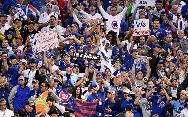 Chicago Cubs fans celebrate after the Cubs defeated the Cleveland Indians 8-7 in Game Seven of the 2016 World Series at Progressive Field on November 2, 2016 in Cleveland, Ohio. (Jason Miller/Getty Images/AFP)