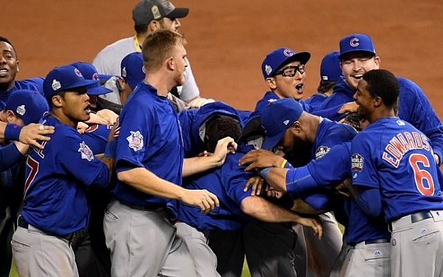 The Chicago Cubs celebrate after defeating the Cleveland Indians 8-7 in Game Seven of the 2016 World Series at Progressive Field on November 2, 2016 in Cleveland, Ohio. (Jason Miller/Getty Images/AFP) The Chicago Cubs celebrate after defeating the Cleveland Indians 8-7 in Game Seven of the 2016 World Series at Progressive Field on November 2, 2016 in Cleveland, Ohio. (Jason Miller/Getty Images/AFP)