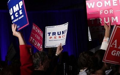 Supporters hold signs during a Trump campaign event November 3, 2016 in Berwyn, Pennsylvania. Melania Trump, wife of Republican presidential nominee Donald Trump, campaigned for her husband, five days before the nation pick her next president. (Alex Wong/Getty Images/AFP)