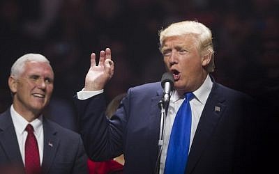 Republican presidential candidate Donald Trump speaks on stage with running mate Indiana Governor Mike Pence during a rally at the SNHU Arena on November 7, 2016 in Manchester, New Hampshire. (Scott Eisen/Getty Images/AFP)