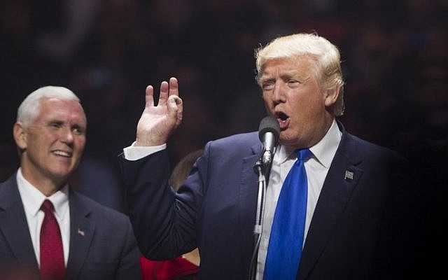 Republican presidential candidate Donald Trump speaks on stage with running mate Indiana Governor Mike Pence during a rally at the SNHU Arena on November 7, 2016 in Manchester, New Hampshire. (Scott Eisen/Getty Images/AFP)