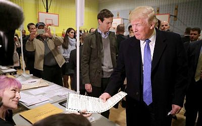 Republican presidential nominee Donald Trump collects his ballot with his son-in-law Jared Kushner on Election Day at a New York public school, November 8, 2016 in New York City. (Chip Somodevilla/Getty Images/AFP)