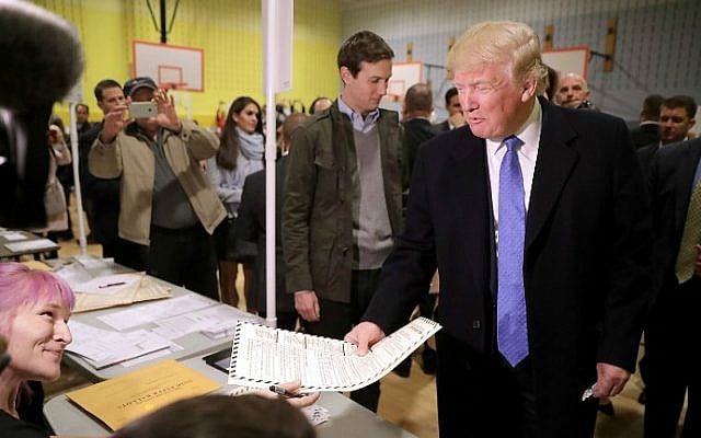 Republican presidential nominee Donald Trump collects his ballot with his son-in-law Jared Kushner on Election Day at a New York public school, November 8, 2016 in New York City. (Chip Somodevilla/Getty Images/AFP)