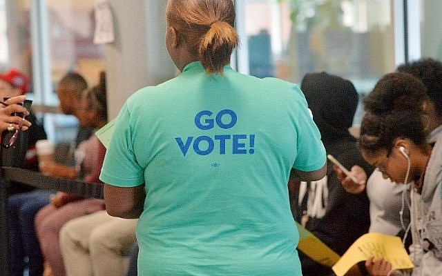 A voter waits in a long line caused by a countywide glitch in the Board of Elections' computer system on November 8, 2016 in Durham, North Carolina. Sara D. Davis/Getty Images/AFP)