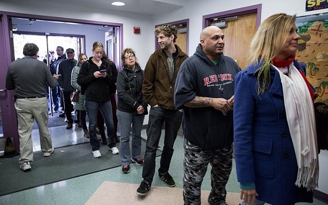 New Hampshire citizens stand in line to cast their vote at Amherst Street Elementary School on November 8, 2016, in Nashua, NH. (Kayana Szymczak/Getty Images/AFP)