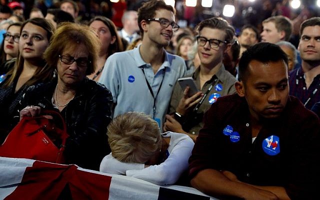 People watch voting results at Democratic presidential nominee former Secretary of State Hillary Clinton's election night event at the Jacob K. Javits Convention Center in New York City, November 8, 2016, (Aaron P. Bernstein/Getty Images/AFP)