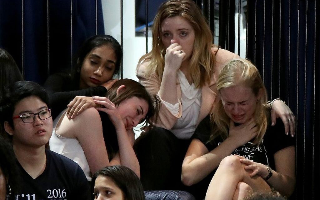 A group of women react as voting results come in at Democratic presidential nominee former Secretary of State Hillary Clinton's election night event at the Jacob K. Javits Convention Center November 8, 2016 in New York City. (Drew Angerer/Getty Images/AFP)
