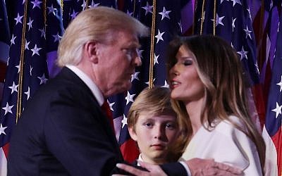 Republican president-elect Donald Trump embraces his wife Melania Trump, as their son Barron looks on, during his election night event at the New York Hilton Midtown in the early morning hours of November 9, 2016 in New York City. (Chip Somodevilla/Getty Images/AFP) Republican president-elect Donald Trump embraces his wife Melania Trump, as their son Barron looks on, during his election night event at the New York Hilton Midtown in the early morning hours of November 9, 2016 in New York City. (Chip Somodevilla/Getty Images/AFP)