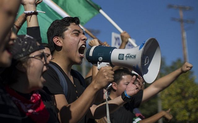Students from numerous area high schools come together in Mariachi Plaza before continuing their march to City Hall to protest the upset election of Republican Donald Trump over Democrat Hillary Clinton in the race for President of the United States on November 14, 2016 in Los Angeles, California. (David McNew/Getty Images/AFP) Students from numerous area high schools come together in Mariachi Plaza before continuing their march to City Hall to protest the upset election of Republican Donald Trump over Democrat Hillary Clinton in the race for President of the United States on November 14, 2016 in Los Angeles, California. (David McNew/Getty Images/AFP)