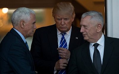 (L to R) Vice President-elect Mike Pence, President-elect Donald Trump, and retired United States Marine Corps general James Mattis exit the clubhouse after their meeting at Trump International Golf Club, November 19, 2016 in Bedminster Township, New Jersey. (Drew Angerer/Getty Images/AFP)