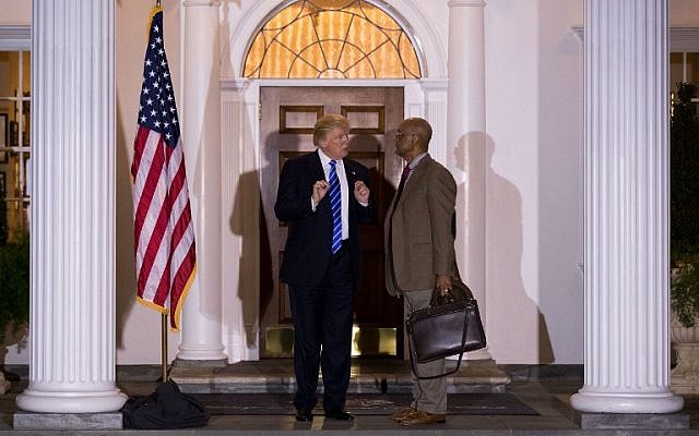  President-elect Donald Trump gestures to the press as he stands alongside Bob Woodson, president of the Center for Neighborhood Enterprise, after their meeting at Trump International Golf Club, November 19, 2016 in Bedminster Township, New Jersey. (Drew Angerer/Getty Images/AFP)