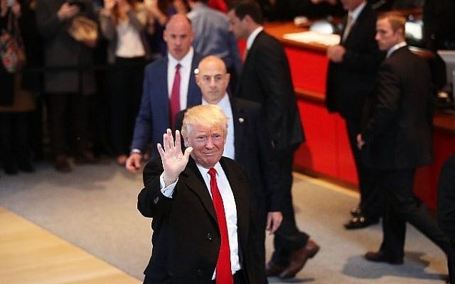President-elect Donald Trump walks through the lobby of The New York Times offices following a meeting with editors at the paper on November 22, 2016 in New York City. (Spencer Platt/Getty Images/AFP) President-elect Donald Trump walks through the lobby of The New York Times offices following a meeting with editors at the paper on November 22, 2016 in New York City. (Spencer Platt/Getty Images/AFP)