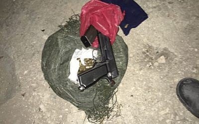 A pistol and ammunition found in an alleged gunsmithing workshop in the Palestinian village of Mirka, outside Jenin, on November 10, 2016. (IDF Spokesperson's Unit)