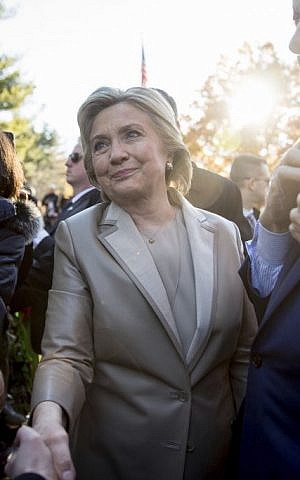 Hillary Clinton, accompanied by her husband, former President Bill Clinton, right, greets supporters outside Douglas G. Grafflin School in Chappaqua, NY, November 8, 2016, after voting. (AP/Andrew Harnik)