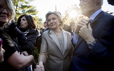 Hillary Clinton, accompanied by her husband, former President Bill Clinton, right, greets supporters outside Douglas G. Grafflin School in Chappaqua, NY, November 8, 2016, after voting. (AP/Andrew Harnik)