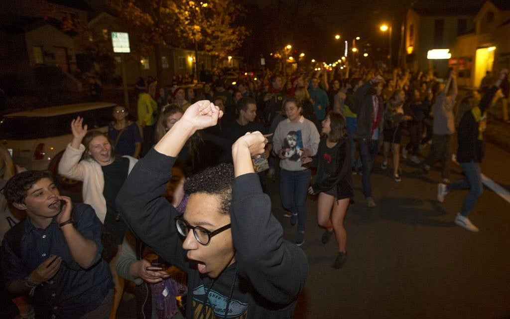 Protesters against President-elect Donald Trump march down a street east of the University of Oregon campus in Eugene, Ore., Wednesday, November 9, 2016. (Chris Pietsch/The Register-Guard via AP) Protesters against President-elect Donald Trump march down a street east of the University of Oregon campus in Eugene, Ore., Wednesday, November 9, 2016. (Chris Pietsch/The Register-Guard via AP)