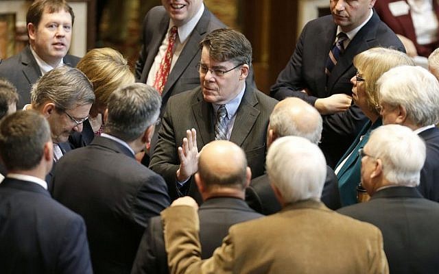 In this May 2, 2014 photo, Iowa Senate Majority Leader Michael Gronstal, center, talks to fellow Senate Democrats on the floor of the Senate at the Statehouse in Des Moines, Iowa. (AP Photo/Charlie Neibergall, File) In this May 2, 2014 photo, Iowa Senate Majority Leader Michael Gronstal, center, talks to fellow Senate Democrats on the floor of the Senate at the Statehouse in Des Moines, Iowa. (AP Photo/Charlie Neibergall, File)