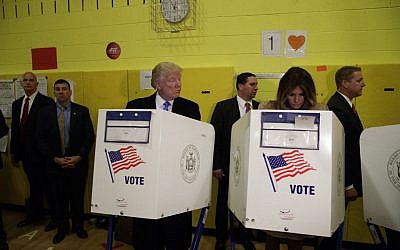 Republican presidential candidate Donald Trump looks at his wife Melania as they cast their votes aat PS-59 in New York, November 8, 2016. (AP Photo/ Evan Vucci)