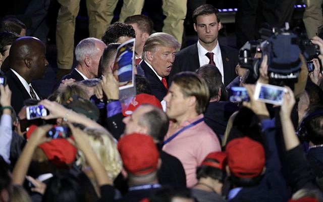 President-elect Donald Trump shakes hands with supporters after giving his acceptance speech during his election night rally, Wednesday, November 9, 2016, in New York. (AP Photo/John Locher)