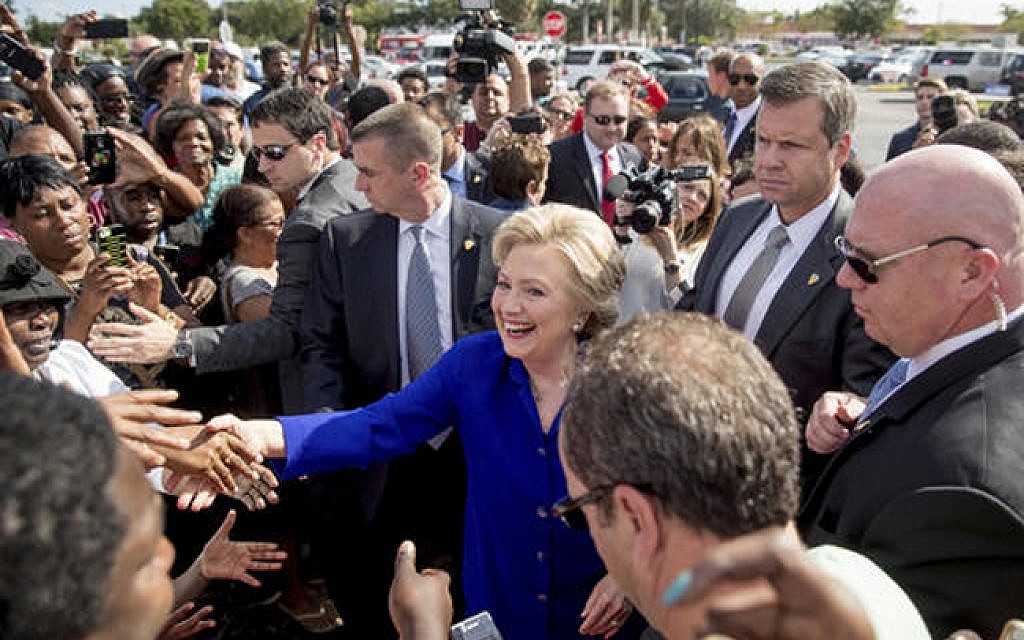 Democratic presidential nominee Hillary Clinton greets people outside an early voting center in Lauderhill, Fla., Wednesday, Nov. 2, 2016. (AP Photo/Andrew Harnik)
