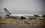 A plane from the Iranian airline Mahan Air, which is backed by the country’s notorious Revolutionary Guard  lands at the international airport in Sanaa, Yemen on March 1, 2015. (AP Photo/Hani Mohammed, File)