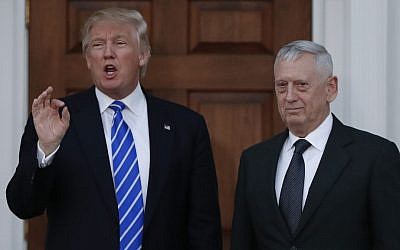 President-elect Donald Trump talks to the media as he stands with retired Marine Corps Gen. James Mattis at the Trump National Golf Club Bedminster clubhouse in Bedminster, N.J., Saturday, Nov. 19, 2016. (AP Photo/Carolyn Kaster)