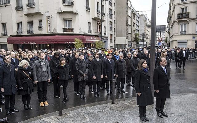French President Francois Hollande and Paris Mayor Anne Hidalgo stand at attention after unveiling a commemorative plaque near the Petit Cambodge and Carillon cafes in Paris, France, on Sunday, November 13, 2016. (Christophe Petit Tesson/Pool Photo via AP) French President Francois Hollande and Paris Mayor Anne Hidalgo stand at attention after unveiling a commemorative plaque near the Petit Cambodge and Carillon cafes in Paris, France, on Sunday, November 13, 2016. (Christophe Petit Tesson/Pool Photo via AP)