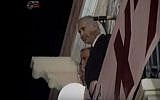 Then opposition leader Benjamin Netanyahu looks out over a right-wing rally in Jerusalem's Zion Square in 1995. The slogan on the sign partially visible below him reads: 'The nation did not decide.' (screen capture: YouTube)