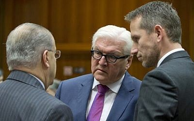 German Foreign Minister Frank-Walter Steinmeier, center, speaks with Cypriot Foreign Minister Ioannis Kasoulides, left, and Danish Foreign Minister Kristian Jensen, right, during a meeting of EU foreign ministers at the EU Council building in Brussels on November 14, 2016. (AP Photo/Virginia Mayo)