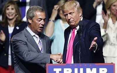 In this Wednesday, Aug. 24, 2016, file photo, then Republican presidential candidate Donald Trump welcomes pro-Brexit British politician Nigel Farage, to speak at a campaign rally in Jackson, Mississippi. (AP Photo/Gerald Herbert, File)