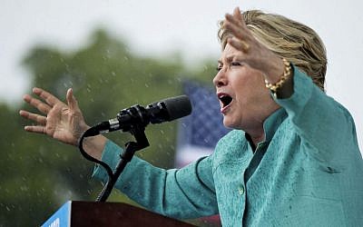 Democratic presidential candidate Hillary Clinton speaks during a heavy rain at a rally at C.B. Smith Park in Pembroke Pines, Fla., Saturday, Nov. 5, 2016. (AP Photo/Andrew Harnik) 