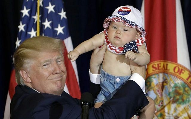 Republican presidential candidate Donald Trump holds up 6-month-old Catalina Larkin, of Largo, Fla., during a campaign rally Saturday, Nov. 5, 2016, in Tampa, Fla. (AP Photo/Chris O'Meara) Republican presidential candidate Donald Trump holds up 6-month-old Catalina Larkin, of Largo, Fla., during a campaign rally Saturday, Nov. 5, 2016, in Tampa, Fla. (AP Photo/Chris O'Meara)