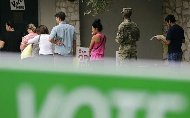 In this Nov. 4, 2016, photo, voters wait in line to cast ballots at an early polling site in San Antonio, Texas. (AP Photo/Eric Gay) In this Nov. 4, 2016, photo, voters wait in line to cast ballots at an early polling site in San Antonio, Texas. (AP Photo/Eric Gay)