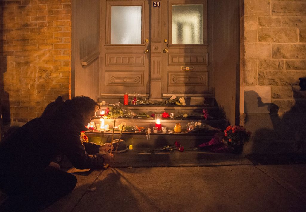 A man places candles in front of the home of singer and poet Leonard Cohen, Thursday, Nov. 10, 2016 in Montreal. (Paul Chiasson/The Canadian Press via AP) A man places candles in front of the home of singer and poet Leonard Cohen, Thursday, Nov. 10, 2016 in Montreal. (Paul Chiasson/The Canadian Press via AP)