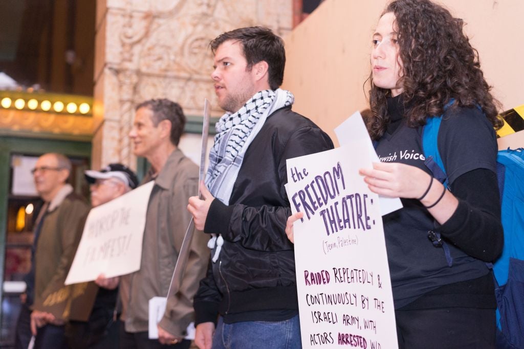 About a dozen protestors showed up after a twitter campaign called to boycott the Israeli film festival. (Ronit Bezalel/Times of Israel) About a dozen protestors showed up after a twitter campaign called to boycott the Israeli film festival. (Ronit Bezalel/Times of Israel)