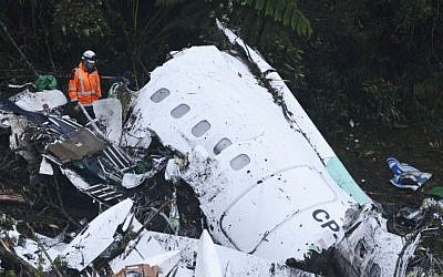 Rescue workers search at the wreckage site of a chartered airplane that crashed outside Medellin, Colombia, on Tuesday November 29, 2016. (AP Photo/Luis Benavides) Rescue workers search at the wreckage site of a chartered airplane that crashed outside Medellin, Colombia, on Tuesday November 29, 2016. (AP Photo/Luis Benavides)