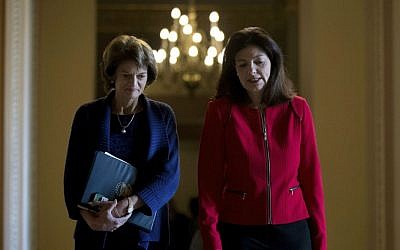 Sen. Lisa Murkowski, R-Alaska, left, and Sen. Kelly Ayotte, R-New Hampshire, leave a Senate Republican conference leadership election meeting on Capitol Hill in Washington, Wednesday, Nov. 16, 2016, after Senate Republicans re-elected Senate Majority Leader Mitch McConnell of Kentucky to be majority leader for the upcoming 115th Congress. (AP Photo/Andrew Harnik)