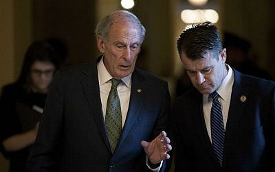 Outgoing Sen. Dan Coats, R-Indiana, left, speaks with Senator-elect Todd Young, R-Indiana, right, as they leave a Senate Republican conference leadership election meeting on Capitol Hill in Washington, Wednesday, Nov. 16, 2016. (AP Photo/Andrew Harnik)
