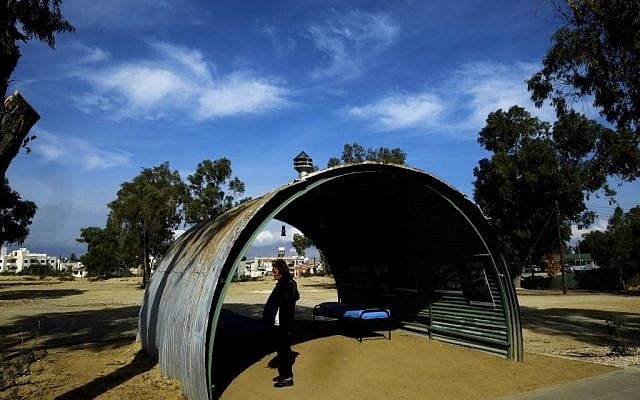 A woman looks the photos of the British camp in a recreation of a semi-circular, corrugated iron hut that housed detainees, at the Cypriot military camp in capital Nicosia, on Wednesday, Nov. 9, 2016. (AP Photo/Petros Karadjias) A woman looks the photos of the British camp in a recreation of a semi-circular, corrugated iron hut that housed detainees, at the Cypriot military camp in capital Nicosia, on Wednesday, Nov. 9, 2016. (AP Photo/Petros Karadjias)
