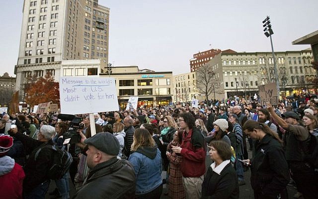 Protesters gather at Rosa Parks Circle in Grand Rapids, Michigan, Thursday, Nov. 10, 2016, in opposition to Donald Trump's presidential election victory. (Cory Morse/The Grand Rapids Press via AP) Protesters gather at Rosa Parks Circle in Grand Rapids, Michigan, Thursday, Nov. 10, 2016, in opposition to Donald Trump's presidential election victory. (Cory Morse/The Grand Rapids Press via AP)